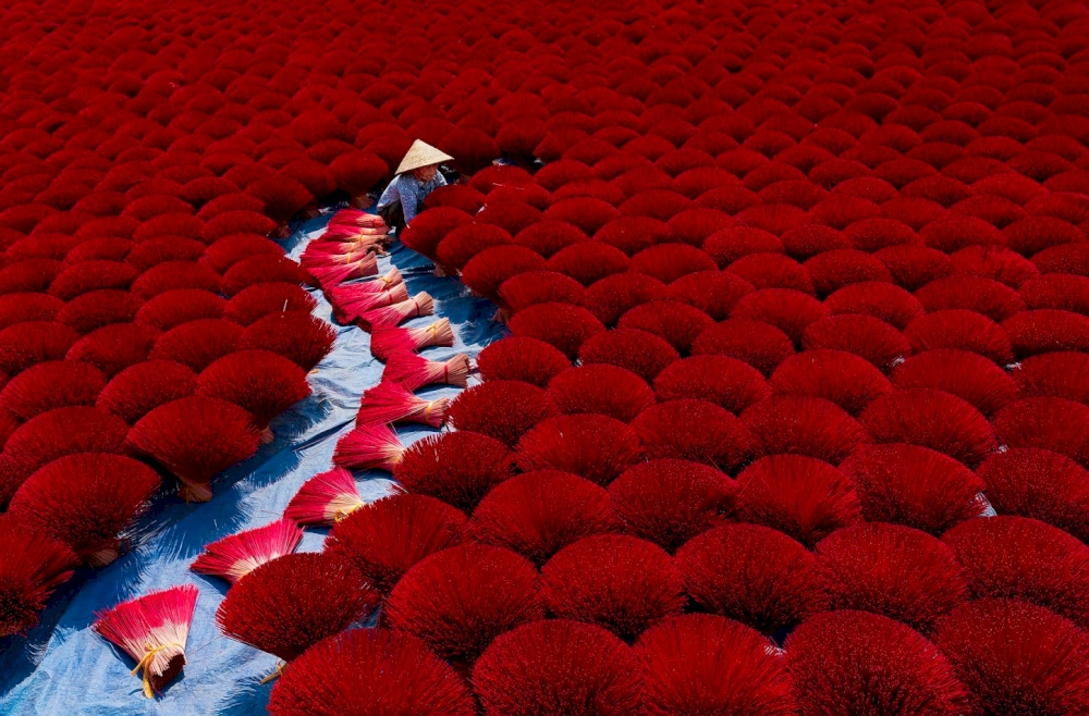 A sea of red incense bundles at Quang Phu Cau Incense Village